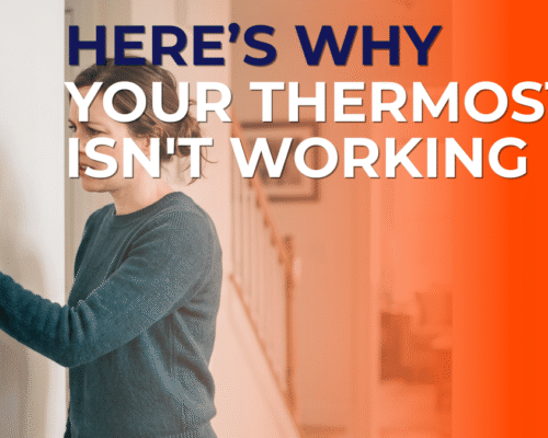 Woman checking an unresponsive wall thermostat in a Central Iowa home, illustrating a thermostat that is not working, with the title "Here's Why Your Thermostat Isn't Working.
